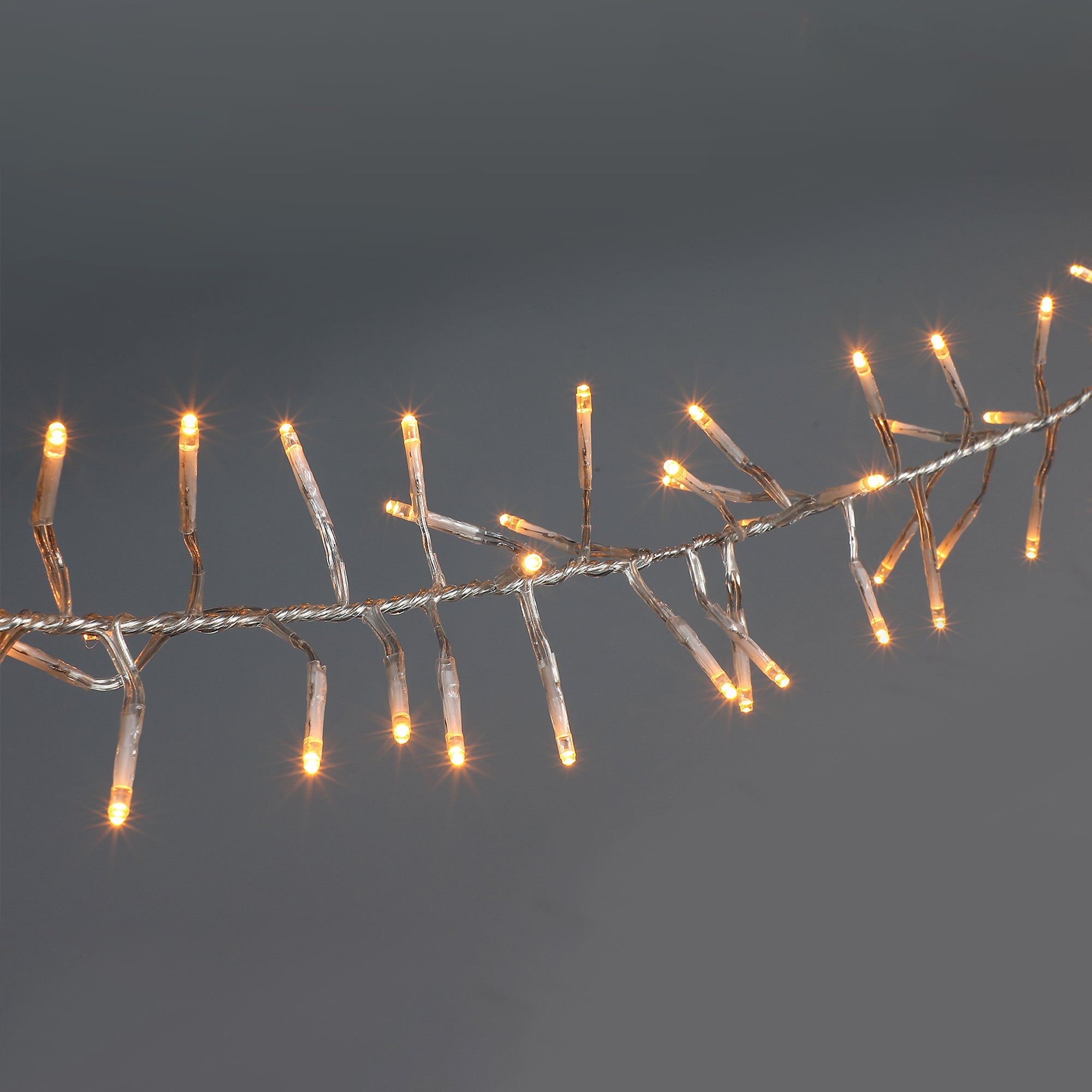Lexi Lighting 720 LED Cluster Christmas Lights with Clear Cable - Amber
